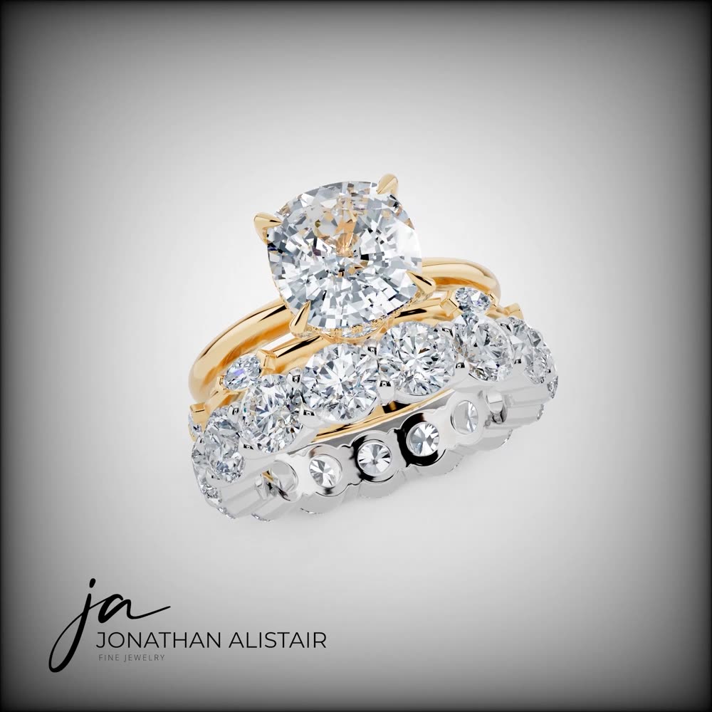 The Camps Bay — a two-tone bridal set featuring a cushion diamond solitaire in yellow gold with a white gold eternity band, custom commission by Jonathan Alistair