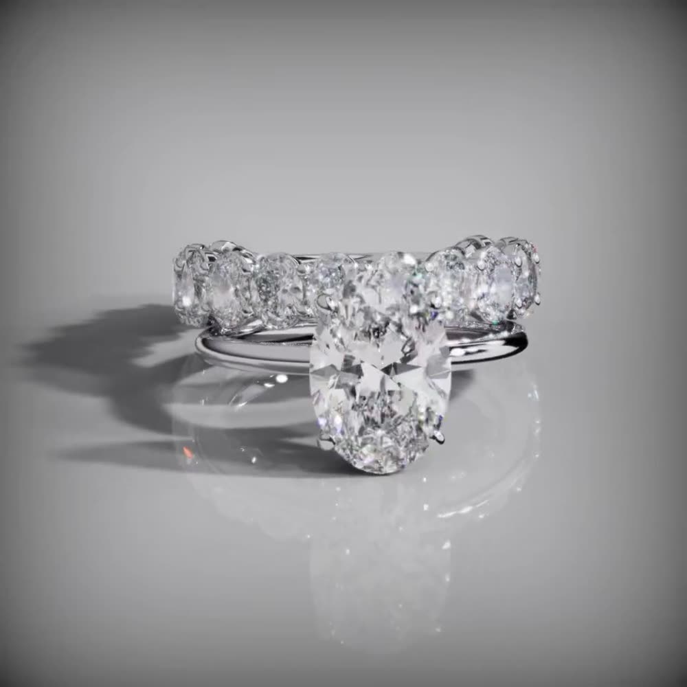 The Cape — Platinum — an oval diamond ring with a matching diamond eternity band in platinum, custom commission by Jonathan Alistair