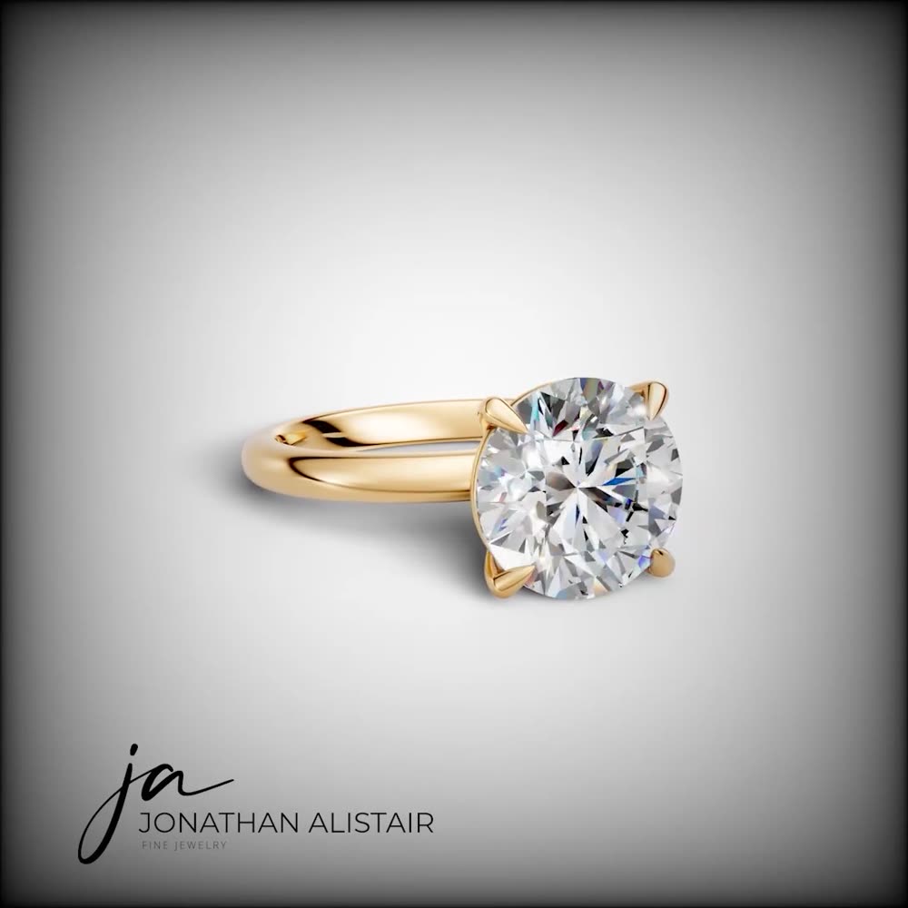 The Stellenbosch — a large round brilliant diamond solitaire in yellow gold, custom commission by Jonathan Alistair